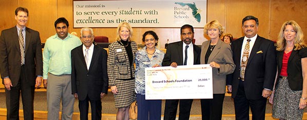 A special ceremony at Tuessday’s Brevard School Board meeting honored a $25,000 donation by Dr. Ravindran Palaniyandi and his wife Ambika to the Brevard Schools Foundation. Frm left are Dr. Brian Binggeli, Siva Pillai, Mr. Pillai, Janice Kershaw, Ambika Ravindran, Dr. Ravindran Palaniyandi, Dr. Barbara Murray, Glad Kurian and Cathy Hall. (Image for SpaceCoastDaily.com)