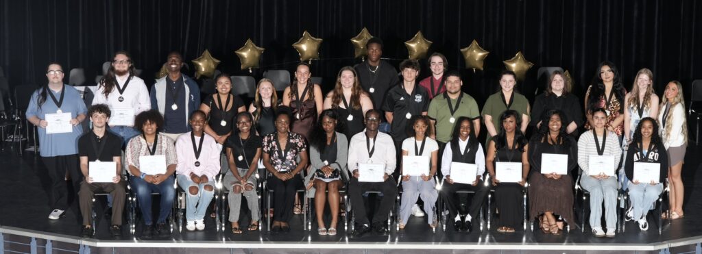 Members of the Take Stock in Children of Brevard Class of 2026 pose together during a scholar recognition ceremony celebrating their academic achievements and post-secondary success.