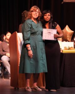Take Stock in Children of Brevard scholar Cerenity Harvey receives recognition alongside Student Services Coordinator Susan Knowles during a scholar awards ceremony.